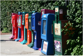 Picture: newspaper boxes along sidewalk
