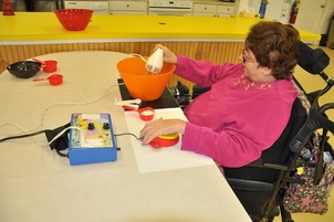 Picture: woman using mixer with adapted switch